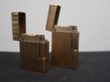 two lighters that are sitting on a table