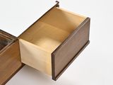 a wooden drawer with a mirror in it on a white surface