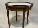une image représentant une petite table ronde avec un plateau en verre