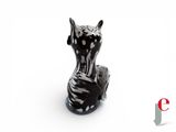 a black and white cat figurine sitting on a white surface