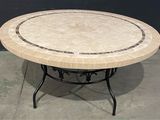 a round table with a marble top and a black base