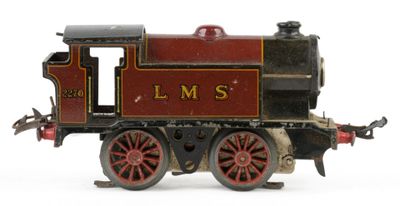 a toy train on a white surface with a white background