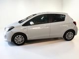 a picture of a white toyota yaris parked in a white room