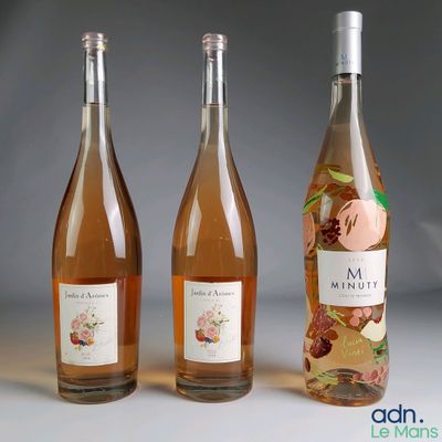 three bottles of wine sitting next to each other on a table