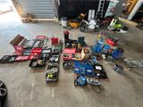 a lot of assorted items on the floor in a garage
