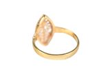 an image of a gold ring with a pink stone in it
