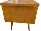 a wooden table with a glass top on a white background