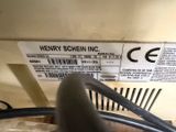 a label on the back of a machine that says henry scheinning