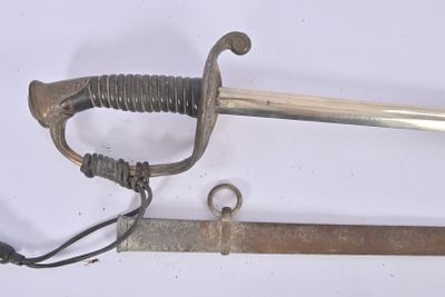 two old swords that are laying on a white surface