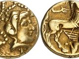 a gold coin with an image of a man on a horse