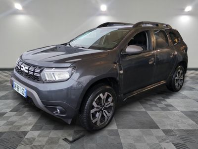 the grey dacia is parked on a checkered tile floor