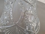 a clear glass vase sitting on top of a table