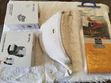 a box of toilet paper, a pair of scissors, and a box of toilet paper on a table