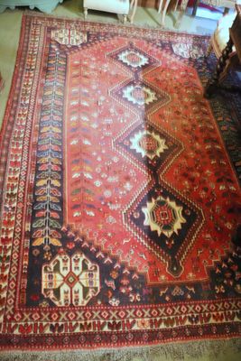 an image of a large oriental rug on the floor in a living room
