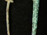these are two pieces of metal on a black surface