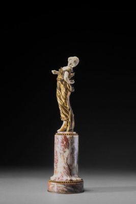 an image of a statue of a woman on a pedestal