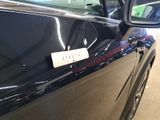 a picture of a car door with a sticker on it