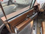 a car that has a broken window and a seat in it
