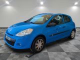 the small blue car is parked in the garage on a checkered floor