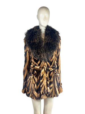 an image of a mannequin wearing a brown and black fur coat