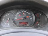 a close up of a dashboard with a speedometer