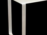 a white table with a glass top on a black background