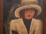 tableau représentant une femme coiffée d'un chapeau et vêtue d'un manteau, avec un oiseau perché sur son épaule