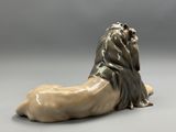 a close up of a statue of a lion on a gray background
