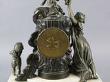 a statue of a woman holding a clock on a stand