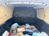 a van that has a lot of stuff in the back of it