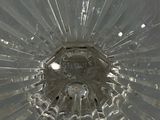 a close up of a glass vase with a hole in it