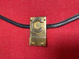 a close up of a red bag with a gold clasp