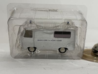 a small toy bus that is in a clear box