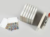 several books are stacked on top of each other on a table