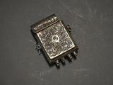 a close up of a small metal object on a table