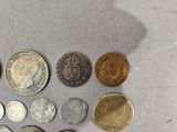 a lot of coins that are on the table