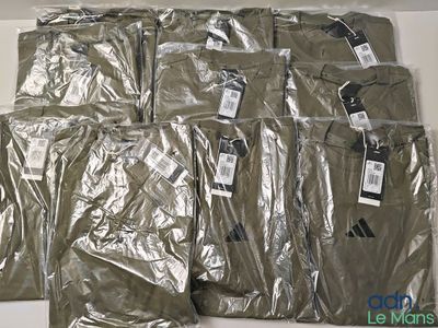 a lot of men ' s shirts wrapped in plastic