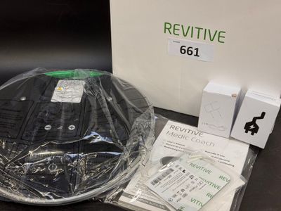 a box with a remote control and other items on the table