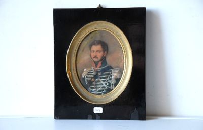 portrait of a man in a striped shirt in a black frame
