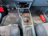 an image of a car dashboard with the center console removed
