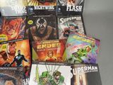 a lot of comic books that are on the table