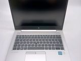 a laptop that is sitting on a white table