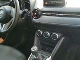 a car dashboard with a steering wheel and a control panel
