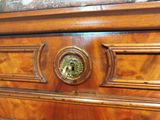a close up of a wooden cabinet with a door handle