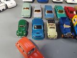 a lot of toy cars that are on the table
