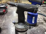 an image of a drill on a table in a workshop