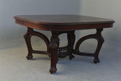a small table with a wooden top on a white floor