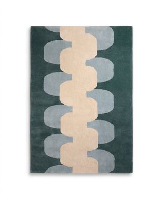 a green rug with circles and circles on it