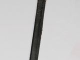 a gold and black sword with a black handle