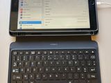 a tablet computer sitting next to a laptop computer on a table